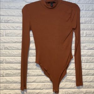 Rust colored ribbed body suit